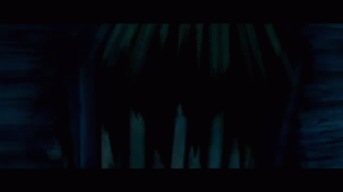 Haunted House Surrounded By Trees And Fence At Night GIF