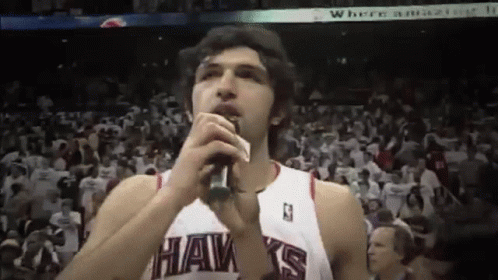 Hawks Player Singing Into Microphone GIF