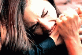 Hayley Marshall Biting Someone's Wrist GIF