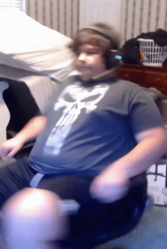 Gamer Sitting In Gaming Chair Head Spinning GIF