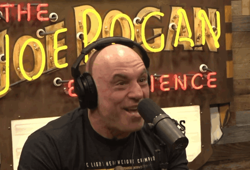 Headphones Man Talking Into Microphone Joe Logan Fence GIF