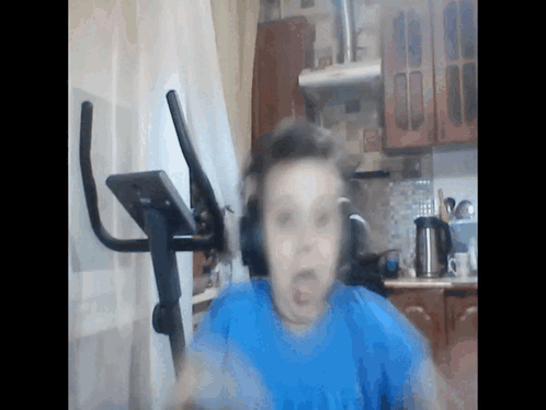 Headphones Person Next to Exercise Bike