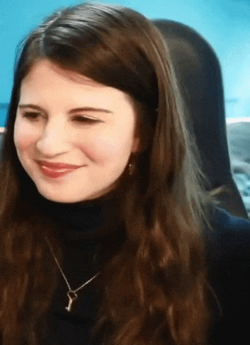 Lovely Lady In Black Gestures Heart Hands GIF