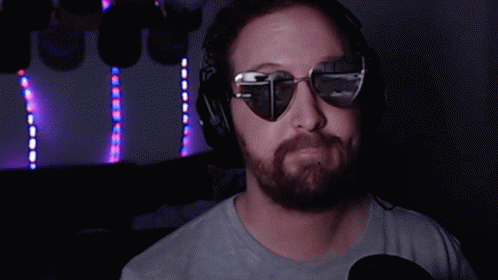 Man Wearing Heart Shades And Heart Hands GIF