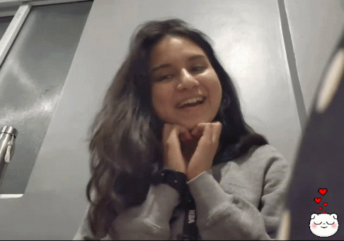 Sweet Girl Wink And Heart Hands GIF