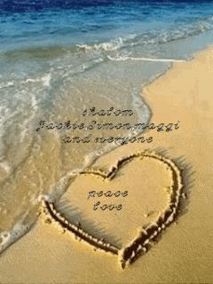 Heart in Sand Saying Peace Love