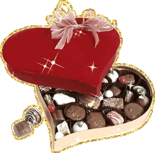 Heart Shaped Box Filled With Chocolates And Pink Bow