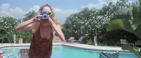 Heather Graham Using Polaroid Camera GIF