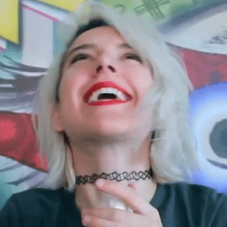 Happy Woman Saying Heaven GIF