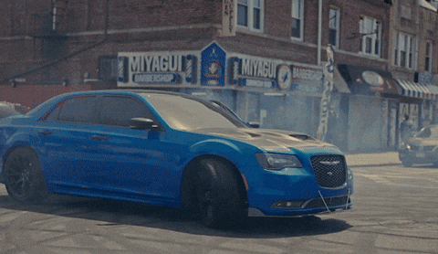 Hellcat Drifting Between Parked Cars GIF