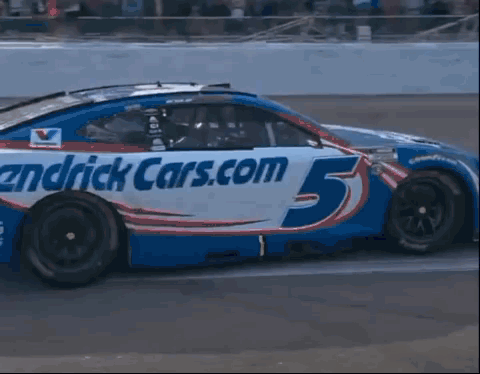 Hendrick Cars.com Race Car Driving Down Track