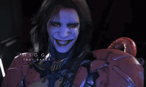 Higgs Troy Baker Is The Name Displayed On The Face Of A Person GIF