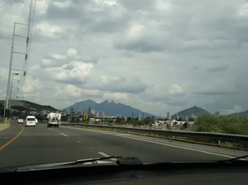 Highway With Mountains and City