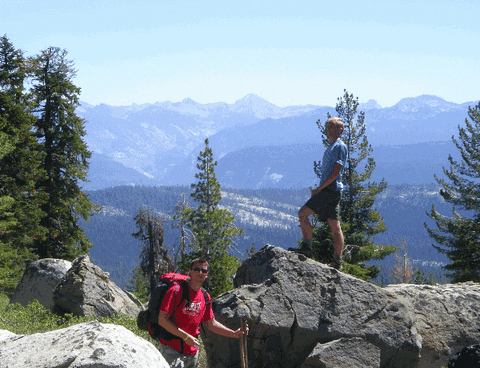Hiking Buddies Standing On Peak GIF