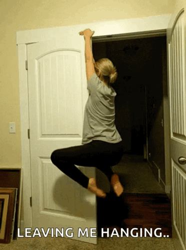 Hilarious Lady Hanging On Door Frame GIF