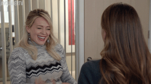 Hilary Duff Giggling With Friend GIF