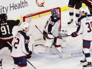 Hockey Game in Front of Ability Health Sign