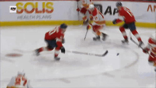Hockey Game in Front of Advertisement