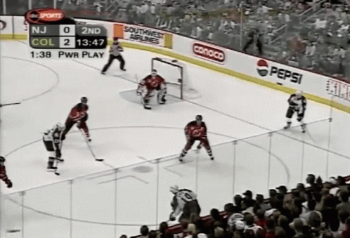 Hockey Game in Front of Crowd