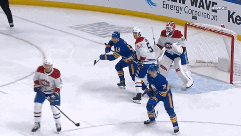 Hockey Game In Front Of Energy Ad GIF