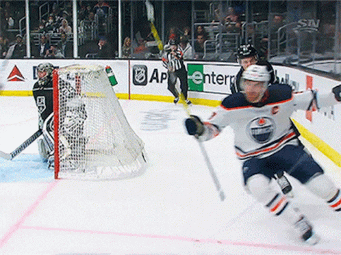 Hockey Game in Front of Enter Sign