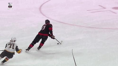 Hockey Game In Front Of Geico Sign GIF
