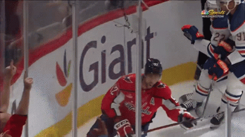Hockey Game In Front Of Giant Ad GIF