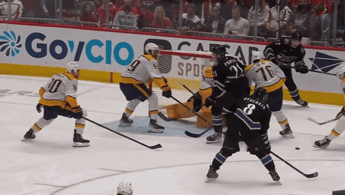 Hockey Game In Front Of Govcio Sign GIF