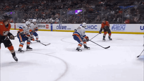 Hockey Game In Front Of Just For Men Sign GIF