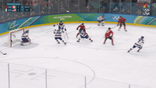 Hockey Game in Front of Milano Cortina Sign