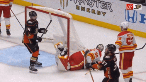 Hockey Game In Front Of Monster Energy Banner GIF