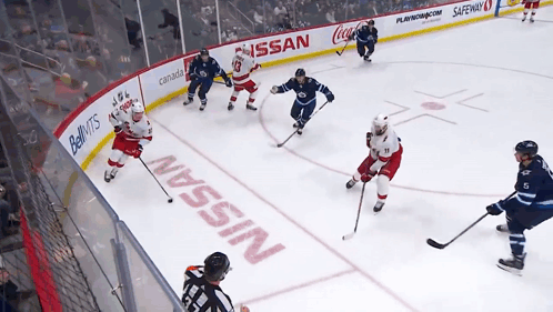 Hockey Game in Front of Nissan Sign