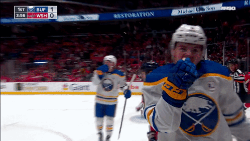 Hockey Game In Front Of Restoration Sign GIF