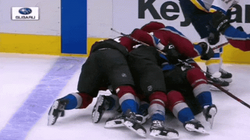 Hockey Game in Front of Subaru Logo