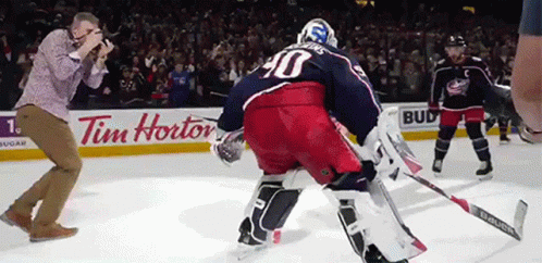 Hockey Game In Front Of Tim Hortons Ad GIF