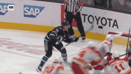 Hockey Game in Front of Toyota Ad