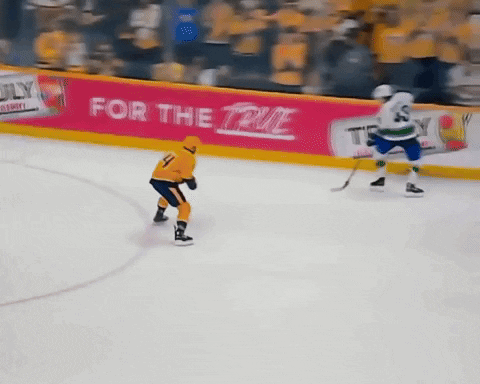 Hockey Game in Front of True Sign