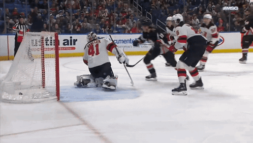 Hockey Game In Front Of Utility Air Ad GIF