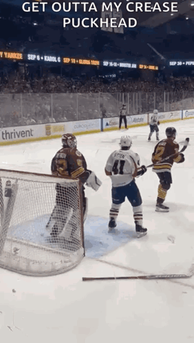 Hockey Game in Stadium with Thrivent Sign