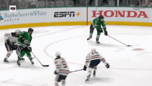 Hockey Game on Ice Rink With Honda ESPN and Baylor Scott & White Ads