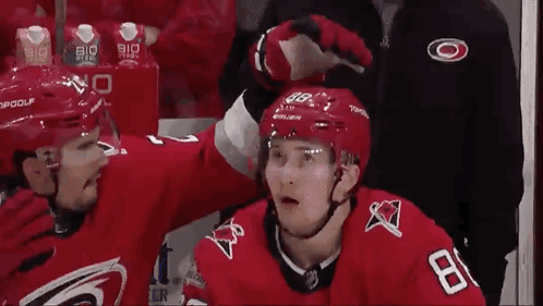 Hockey Player 18 Next to Another Player