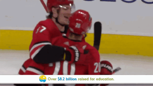 Hockey Player 21 Hugging Another Player