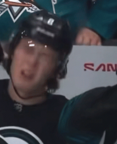 Hockey Player Crying in Front of San Jose Sign