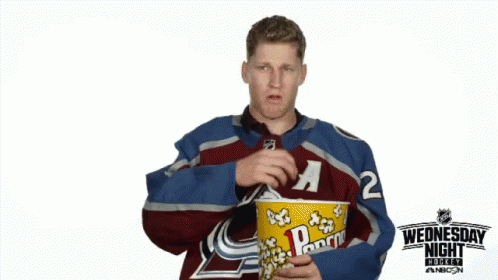 Hockey Player Eating Popcorn