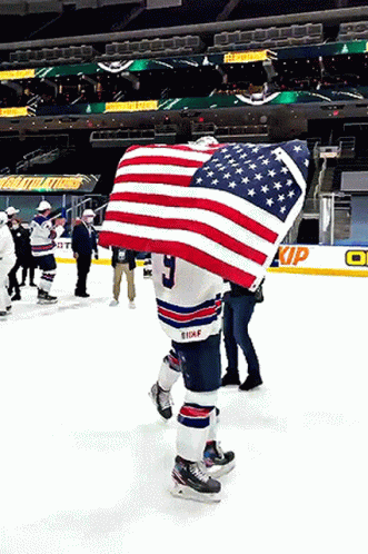 Hockey Player Holding American Flag