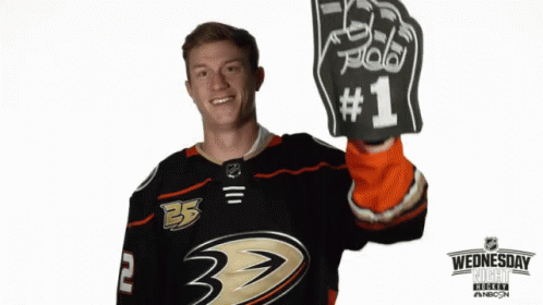 Hockey Player Holding Foam Hand GIF