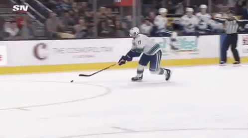 Hockey Player Holding Puck