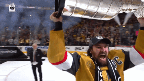 Hockey Player Holding Trophy With SN Logo