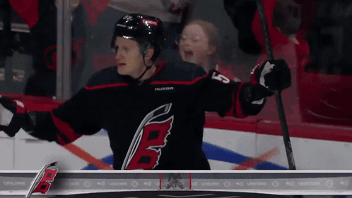 Hockey Player in Black and Red Jersey