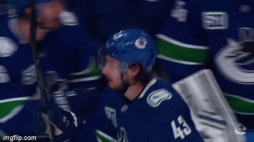 Hockey Player in Blue Jersey 43